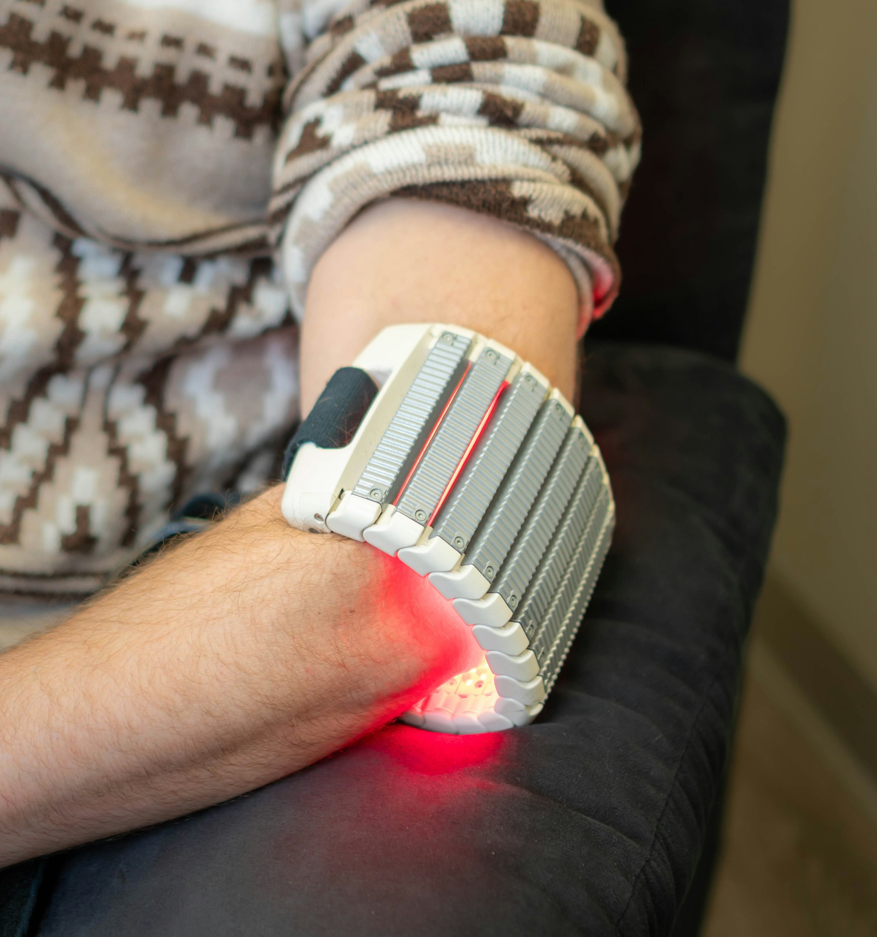 Red light therapy device used on an arm